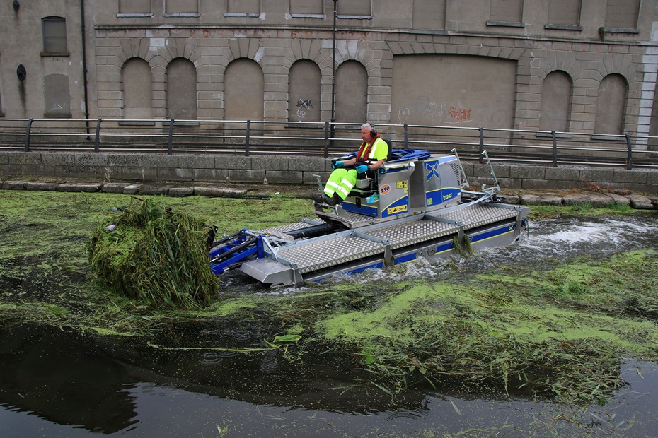 Newry, Mourne and Down District Council maintenance crew member Brendan McCabe clearing invasive weeds from Newry Canal.