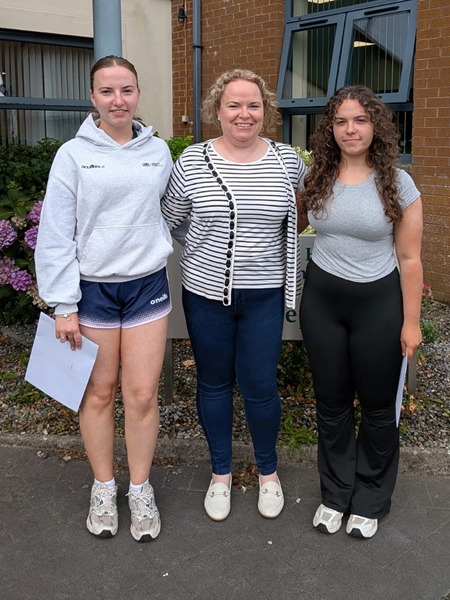 Eimear Murphy (A Level) and Niamh Murphy (AS Level) collecting their results with their mum at Sacred Heart Grammar School.  
