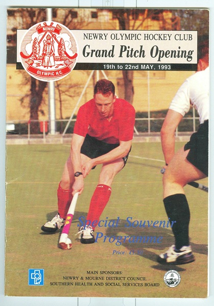 Souvenir programme relating to the grand opening of a new pitch at Newry Olympic Hockey Club in May 1993.  Billy McConnell from Newry won a bronze medal with Great Britain at the 1984 Olympics in Los Angeles.  At the Seoul Olympics in 1988, Violet McBride from Kilkeel was vice-captain of the Great Britain hockey team. Newry and Mourne Museum Collection.