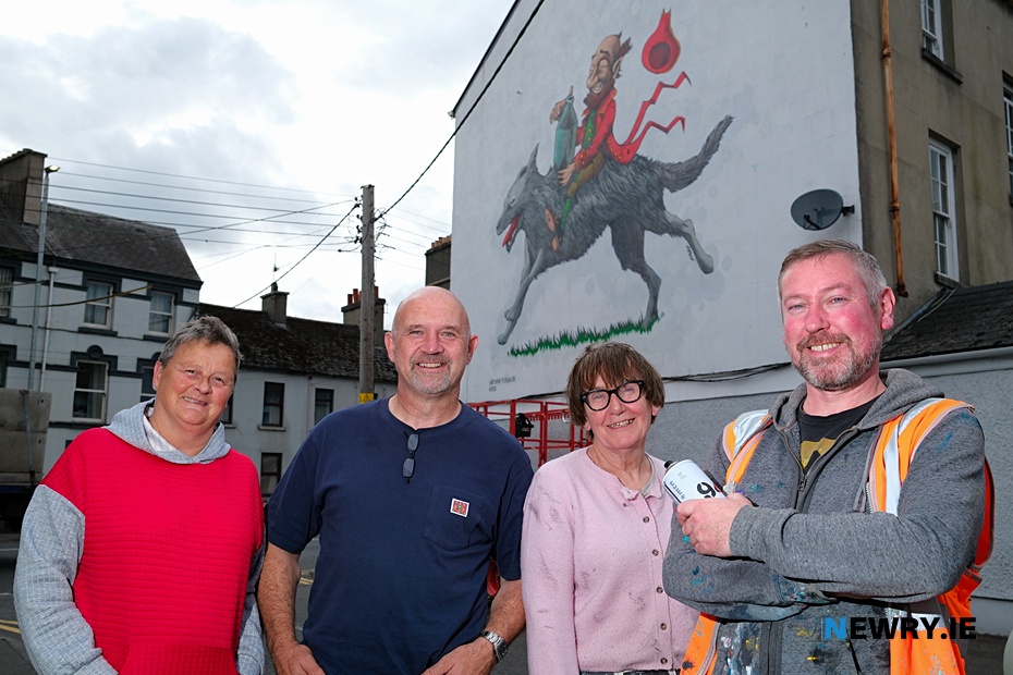 Theresa Hince, Garry McElherron, Iúr Cinn Fleadh; Nina West and artist Kev Largey/ KVLR with the  new fleadh mural at Kilmorey Street in Newry, a tribute to the late artist John Farrelly. Photograph: Columba O'Hare/ Newry.ie 