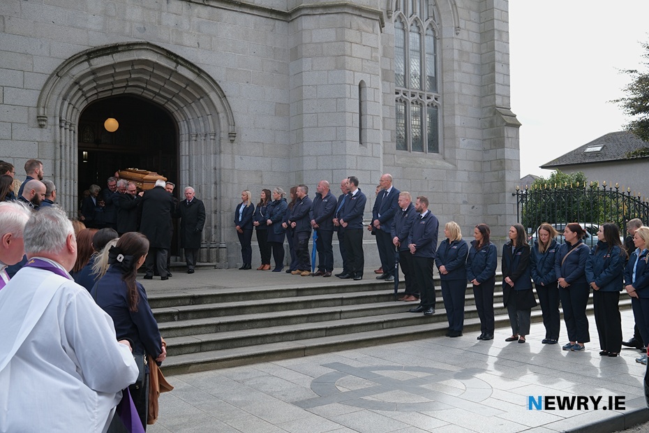 CRASH Services employees form a Guard of Honour as the remains of their founder Michael McKeown leaves Newry Cathedral. Photograph: Columba O'Hare/ Newry.ie 