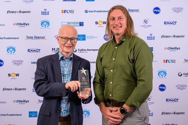 Peter Murray former Buttercrane Manager receives an award at the Greater Newry Business Awards for Outstanding Contribution to the Greater Newry Area from a representative of The Exact Group. Photograph: Colum Lynch Photography.