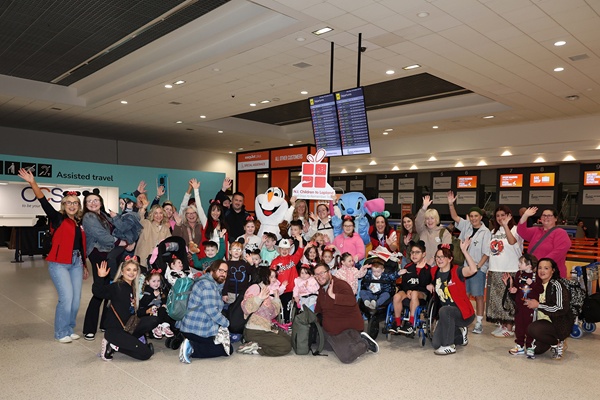 The children pictured with their families on the Disneyland Paris trip.