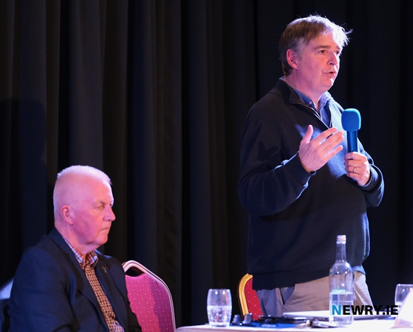 Brian Cleland, Chairman of Newry People's Forum speaking at last nights meeting while Forum member Eddy Curtis looks on