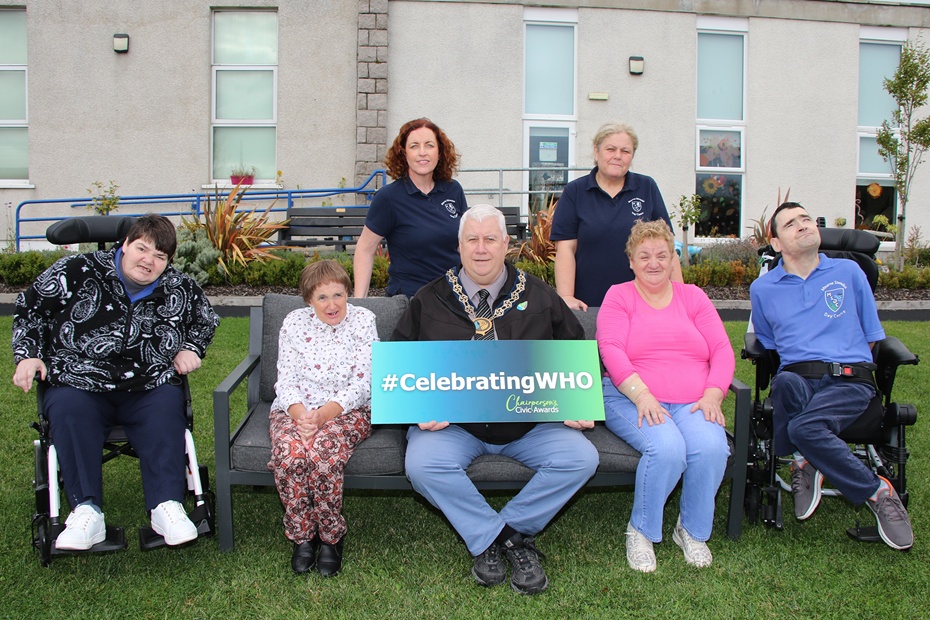 Council Chairperson Councillor Glyn Hanna, visits Mourne Stimulus, one of his chosen charities for the year, to launch the Council's Annual Civic Awards and the #CelebratingWHO campaign. Pictured front from left are Heather Wilson, Marina Joyce, Chairperson Councillor Glyn Hanna, Joanne McVerry and William Houston. Back: Bronagh Trainor, Community Fundraiser, and Gemma Phillips, DCW Care Worker.