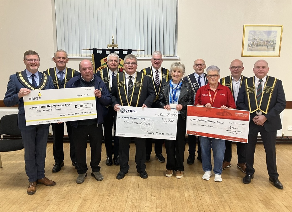 Newry Royal Black District Officers making presentation to the 3 Charities Representatives