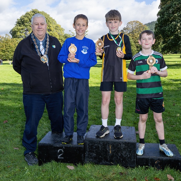 The first three runners home in the Individual Boys’ Race with Newry, Mourne and Down District Council Chairperson, Councillor Glyn Hanna. Included with winner Manus Bellew (centre) from St Patrick’s Primary School, Crossmaglen are second placed Eoin Veldrick (second left) from St Clare’s Abbey Primary School and third placed Aidan Mc Cullagh from St Micheal’s PS, Finnis.