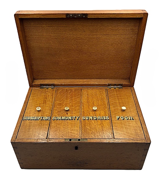The alms box is divided into four clearly labelled compartments: Subscriptions, Community, Sundries and Poor. Subscriptions supported the wider work of the convent, community funds met the needs of the Sisters themselves, sundries covered miscellaneous expenses, and monies placed in the poor fund were distributed directly to those in need.  Newry & Mourne Museum Collection