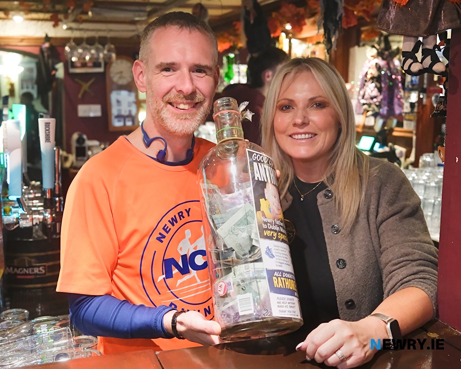 Anthony Morgan with Sabrina McTaggart with some of the money raised for Rathore School. Photograph: Columba O'Hare/ Newry.ie 
