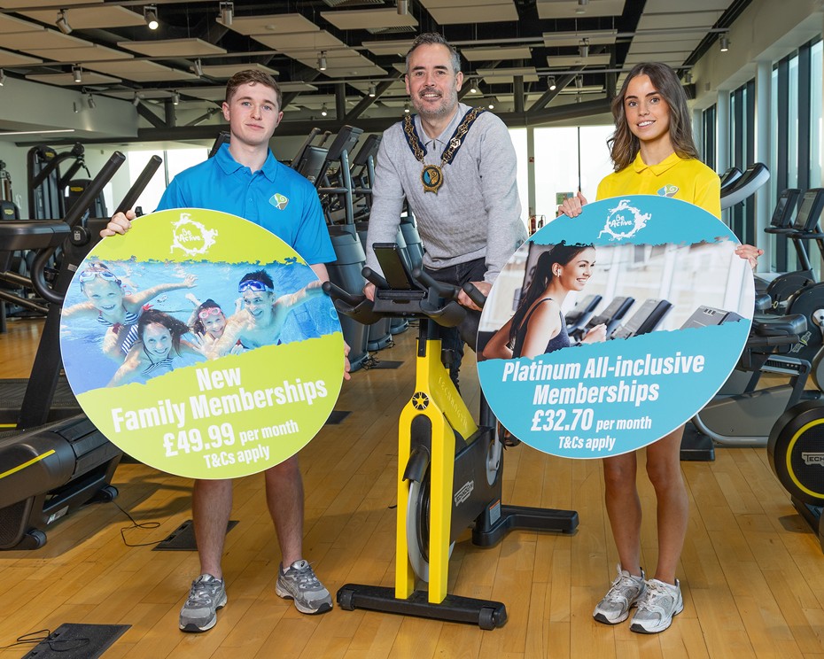 Newry, Mourne and Down District Council Chairperson, Cllr Philip Campbell launches the NMD Be Active New Year membership campaign with Down Leisure Centre lifeguards Max Crane and Cora Smyth.