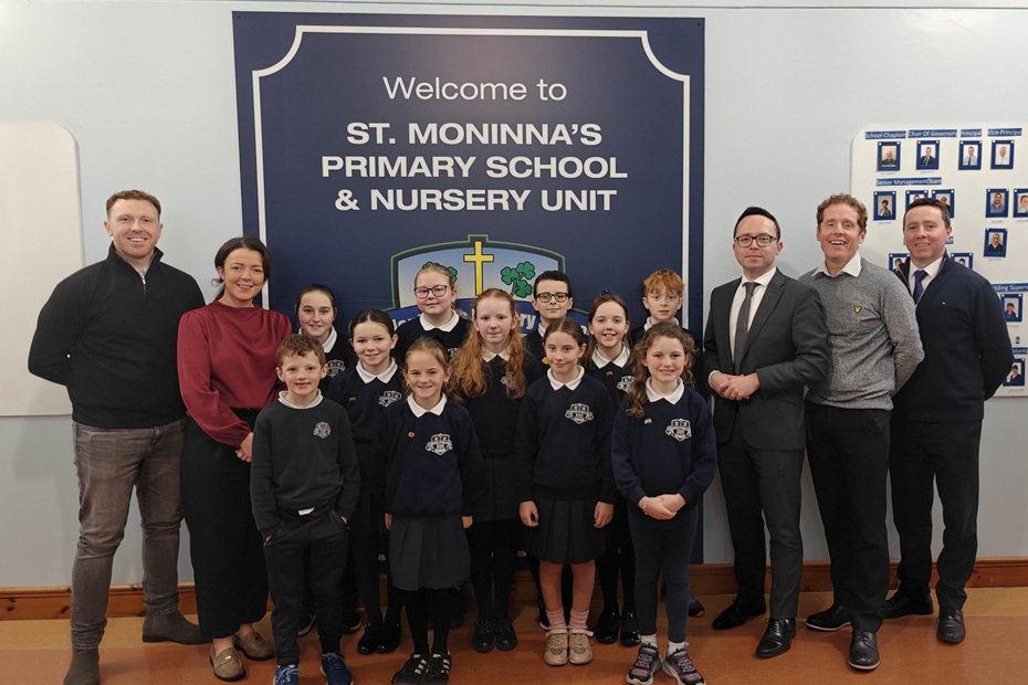 Infrastructure Minister Liz Kimmins with Dáire Hughes MP and Newry City Councillor Cathal King at St. Moninna’s Primary School in Cloughoge.