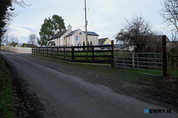This gate will be replaced by a bridge that will sit over the Southern Relief Road with Roisin Morgan's home in the background. Photograph: Columba O'Hare/ Newry.ie 