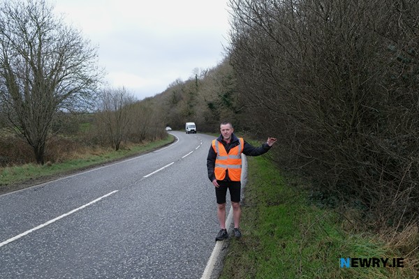 Neill McCourt showing the issue with overgrowing vegetation on the A27. 