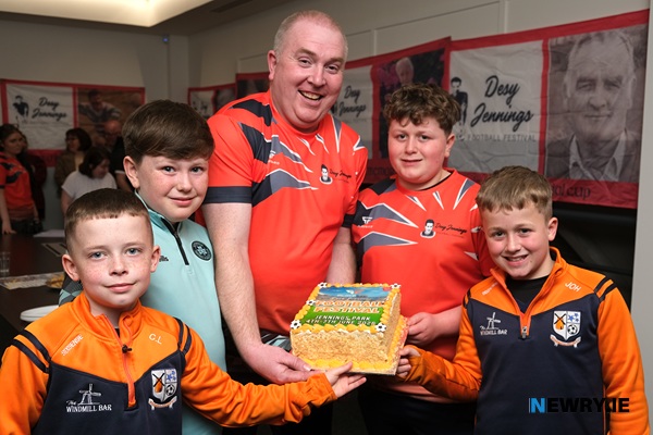 Pictured at the launch of the Desy Jennings Football Festival with a celebratory cake were from left: Christopher Loughran, Charlie McCrink, Marty Jennings, Patrick O'Hare and Joseph O'Hare. Photograph: Columba O'Hare/ Newry.ie 