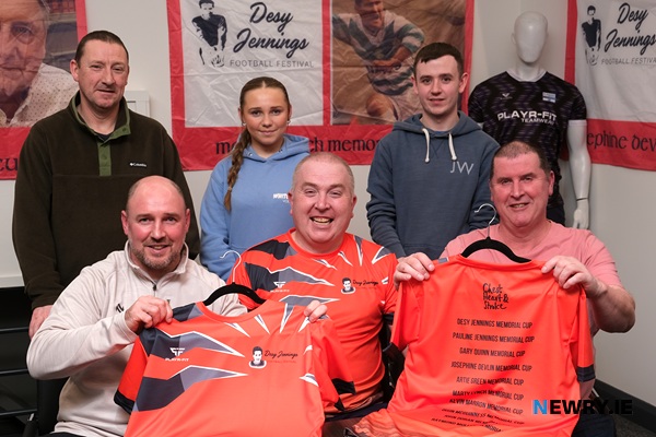 The Oisin McGuinness Memorial Cup, Artie Green Memorial Cup and the Gary Quinn Memorial Cup - Marty Jennings, front centre with members of the McGuinness, Green and Quinn families at the launch of the Desy Jennings Football Festival. Included from left are Conor McGranaghan, Gary Quinn, Kelsey Quinn, Shea Davey and Jimmy Green. Photograph: Columba O'Hare/ Newry.ie 
