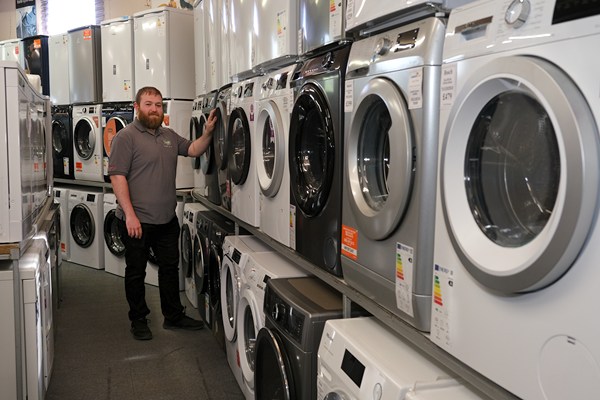 Chris McEvoy with just some of the Washing Machines on offer at Dalzells