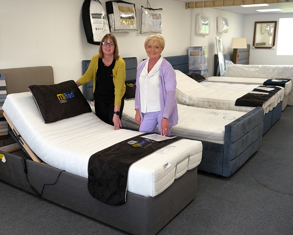 Kathryn Murdock and Sharon Dalzell with some of Dalzells range of adjustable beds. 