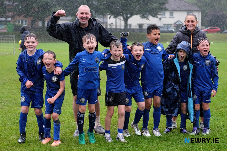 A wet but jubilant Warrenpoint Town FC team who won the Pauline Jennings Memorial Cup. Photograph: Columba O'Hare/ Newry.ie 