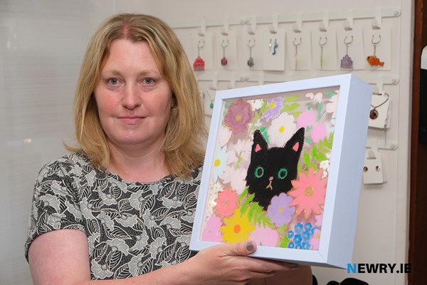 Cheryl Gamble with one of her glass paintings at the Social Enterprise Showcase at Head Injury Support.