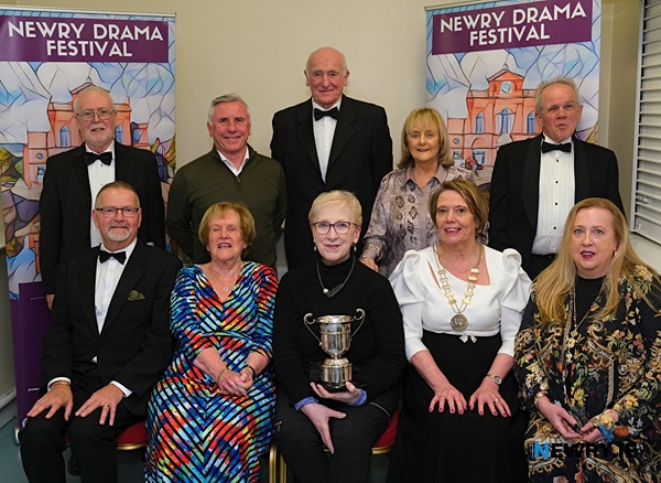 Mary Goss, front centre accepts the Newry Musical and Orchestral Society Cup for the Best Costumes at Newry Drama Festival on behalf of Bernie McParland while looking on are festival committee members and Adjudicator Tony Finnegan. Photograph: Columba O'Hare/ Newry.ie 