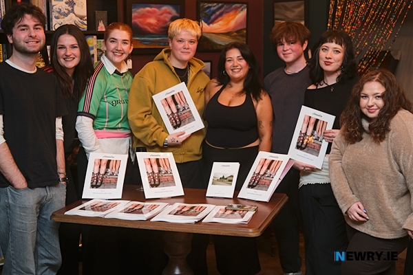 Contributers and artists launching issue 2 of cOmmOn in the Bookshelf, Newry are from left: Ciaran Coleman, Sian Foley, Norah McAleenan, Shelby Connolly, Niamh Reavey, Liam Seacroft, Sarah Keohoe and Carly Keating. Photograph: Columba O'Hare/ Newry.ie 