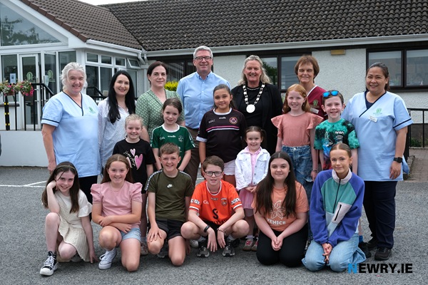 Flynn Performing Arts singers who sang for residents of Avila Nursing Home in Bessbrook at a Newry Chamber Music event. Included back from left are: Brenda Larkin, Care Assistant, Avila; Fiona Flynn, Flynn Performing Arts; Joanne Quigley McParland, Newry Chamber Music; Cathal O'Neill, Manager, Kilmorey Care; Cllr Geraldine Kearns, Vice Chairperson, Newry, Mourne and Down District Council; Patricia O'Neill, Activities Co-Ordinator, Avila and Kimi Cuartero, Care Assistant, Avila. Photograph: Columba O'Hare/ Newry.ie