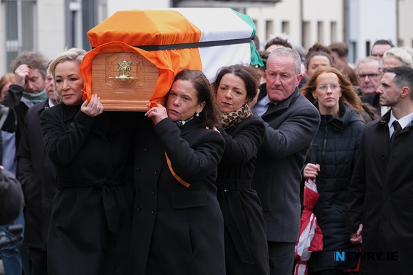 Sinn Fein representatives carry Mickey Brady's remains along Dominic Street. 