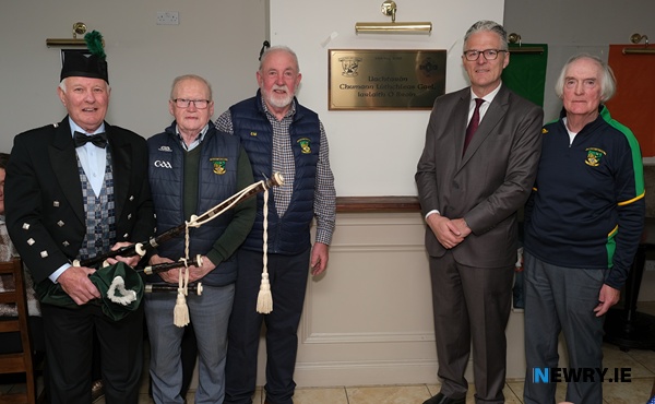 Unveiling a plaque to commemorate the visit by GAA President Jarlath Burns to St Michael's GAC Killean. Included from left: P.J. Boyle, Michael Connolly, Eddie Mullen, Co Chair, St Michael's GAC, Jarlath Burns and Pat Hill, Co Chair, St Michael's GAC. Photograph: Columba O'Hare/ Newry.ie 