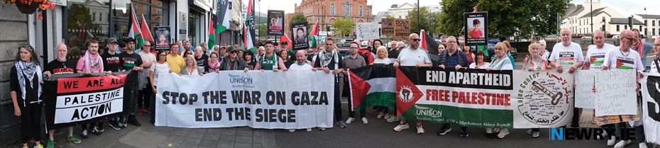 Dáire Hughes MP with protestors in August 2025. Photograph: Columba O'Hare/ Newry.ie 