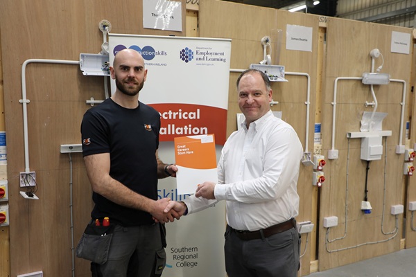 Joshua Porter from Newry who was the 2026 runner-up in the Electrical Installation SRC Intercampus Competition.  Joshua is pictured alongside SRC Curriculum Area Manager Gareth Mone.