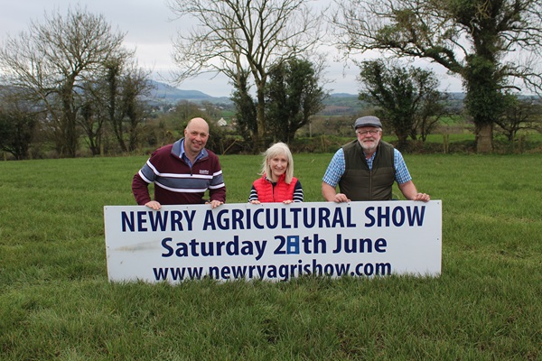 Discussing plans for Newry Show 2025: Brian Lockhart, chairman of Newry Show, right, with Robert and Helen Cartmill, from Derrywilligan Road, Bessbrook: the owners of the site on which the 2025 show will take place