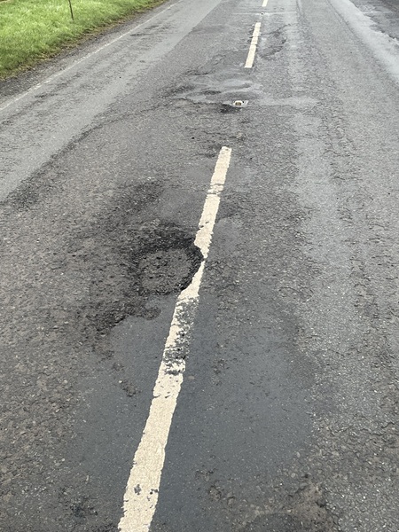 Just one of the potholes on the A29 road near Silverbridge