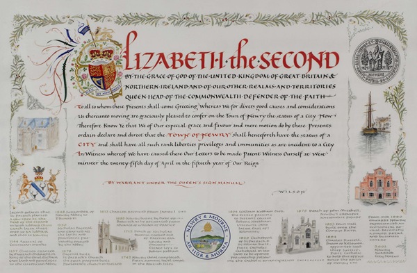 Charter granting city status to Newry in 2002. The artwork, by Wendy Selby, features a border of Irish yew tree leaves, representing the tradition of St. Patrick planting a yew tree ‘at the head of the strand’ above the Clanrye River, from which Newry derives its name. Newry & Mourne Museum Collection