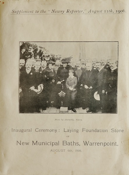 Photograph of newspaper supplement showing the Inaugural Ceremony for laying of the foundation stone of Municipal Baths by Mrs. Roger Hall of Narrow Water Castle in 1907.  The Baths were opened in June 1908. Newry and Mourne Museum Collection