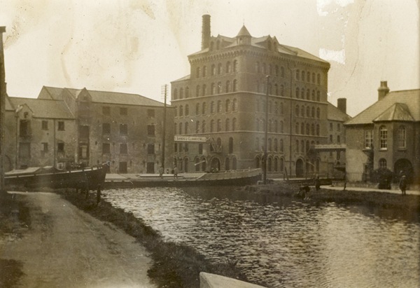 Photograph of Clanrye Mill [Sands’ Mill] a cattle feed Manufacturer in Newry with the Canal turning basin in the foreground, 1908. Newry & Mourne Museum Collection