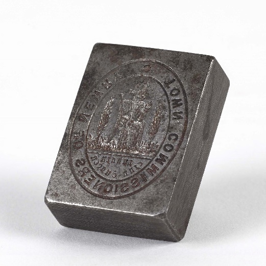 Seal used by the Town Commissioners of Newry which was set up in 1865. The design is based on the seal of the medieval Cistercian Abbey of Newry and features a mitred abbot and cross. Newry & Mourne Museum Collection
