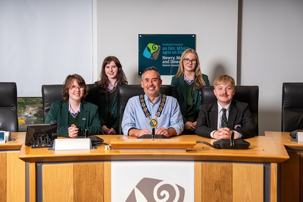 Newry Mourne and Down District Council Chairperson, Cllr Philip Campbell is photographed with the winning team from St Louis Grammar School in Kilkeel following his Dragon’s Den style event which he hosted to mark Local Democracy Week. Included back from left:  Niamh Crowley and Erin Comac. Front: Aoife Dinsmore and Shay Burden 