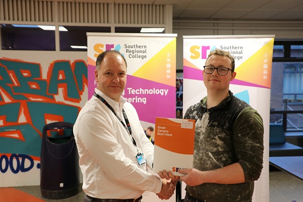 Lee McCartan from Rathfiland who finished 3rd in the Plastering category at the SRC 2026 Intercampus SkillBuild competition.  Lee is pictured alongside Curriculum Area Manager Gareth Mone.