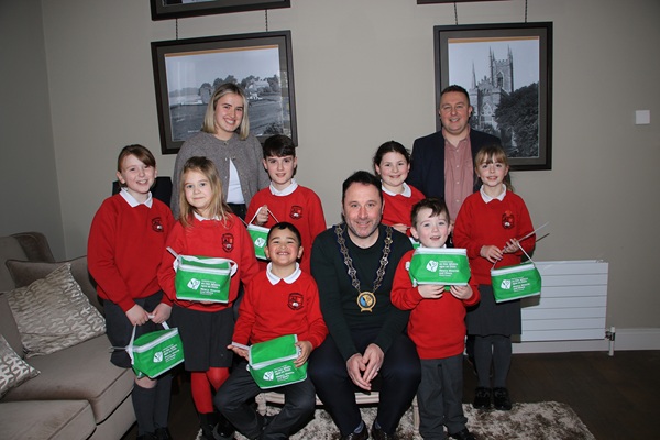NMDDC Chairperson, Councillor Pete Byrne provides goody bags for the members of Bessbrook Primary School Council. Also pictured are Councillor David Taylor and teacher, Emma Adamson.