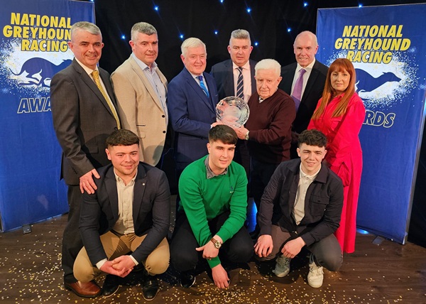 Hall of Fame 2024 inductee, Newry man Brendan Matthew, surrounded by his family being presented with his award by Pat Flanagan, Chairman of Greyhound Racing Ireland, at the National Greyhound Racing Awards hosted in Shelbourne Park on Sunday night.