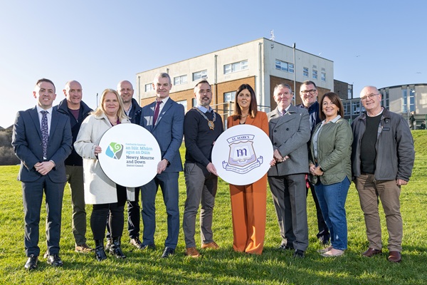 Principal of St. Mark’s High School, Aidan McGivern (centre), with Newry, Mourne and Down District Council Chairperson, Cllr Philip Campbell, Marie Ward, Chief Executive Marie Ward and John Allen, Chairperson of the Board of Governors with members of the school leadership team, councillors and council officers. 