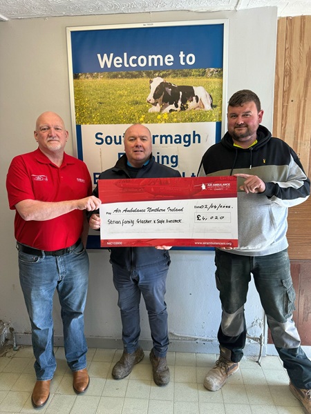 Air Ambulance NI Volunteer Robert Phoenix pictured with Robert Reavey from South Armagh Farming Enterprises and Aaron Strain.