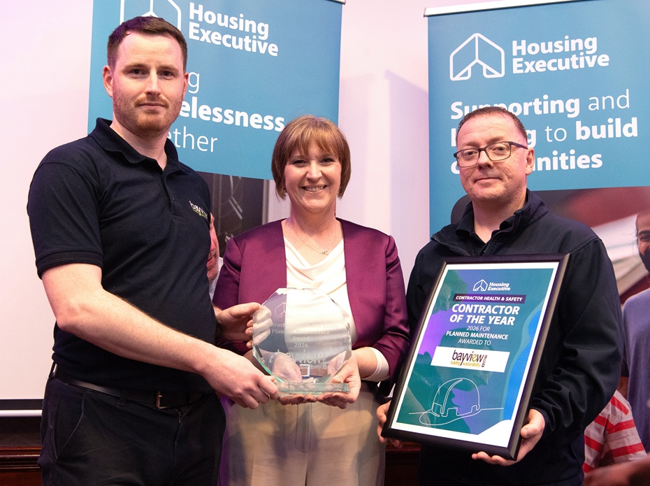 Conall Burns and Ciaran Brannigan from Bayview Contracts received the award for Planned Maintenance Services from Housing Executive Chair, Nicole Lappin
