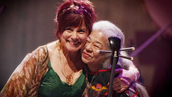  Singers Cathy Jordan and Misako Koja embrace on stage after their performance in the Irish Pavilion at Osaka Expo 25