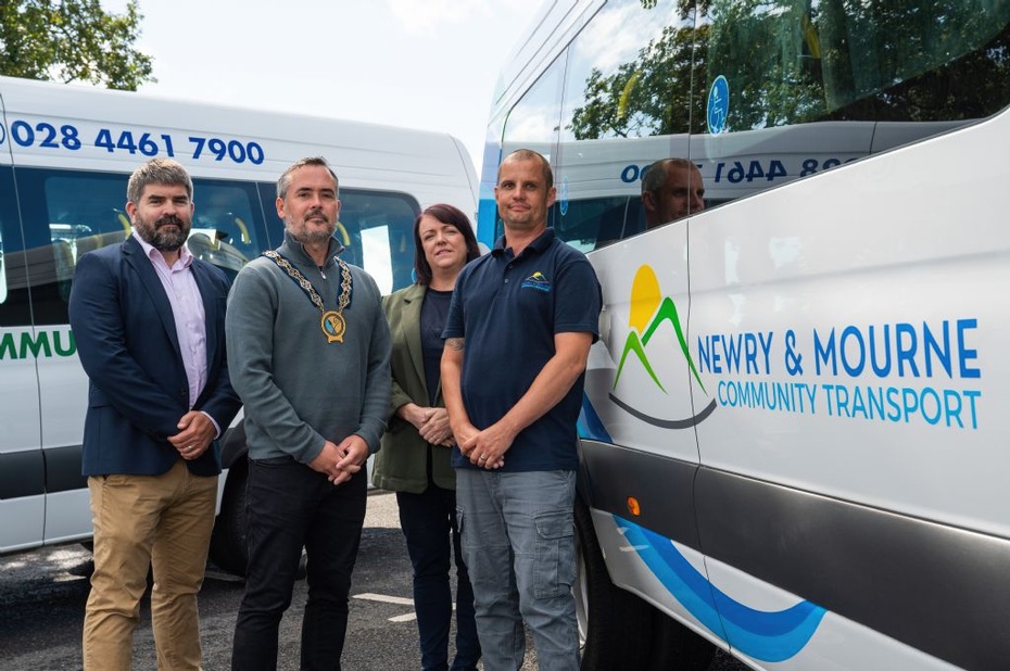 Newry, Mourne and Down District Council Chairperson Councillor Philip Campbell (second left), with Chris Moore (left) from the UK Shared Prosperity Fund which, supported by the Strategic Stakeholder Forum, provided funding for two new minibuses and drivers for Down Community Transport and Newry and Mourne Community Transport. Included are Down Community Transport manager Shelieen Brady and Newry and Mourne and Community Transport Chief Executive Stephen Yeomans.  