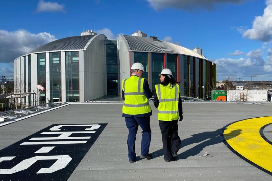 rish Health Minister Carroll MacNeill and Health Minister Mike Nesbitt tour the site of the new Children's Hospital in Dublin.