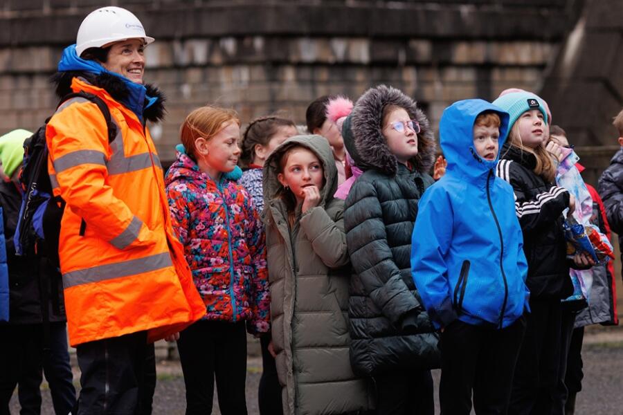 School children watch drones in operation during Engineers Week.