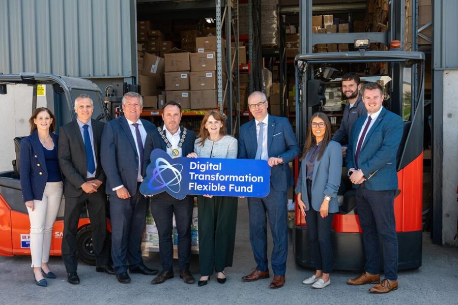 Department for Economy (DfE) Minister Dr Caoimhe Archibald and representatives from the Department of Agriculture, Environment and Rural Affairs (DAERA) with NMDDC Chairperson, Cllr Pete Byrne, visited SJ Henderson Fulfilment in Kilkeel to celebrate the success of the Digital Transformation Flexible Fund (DTFF). 