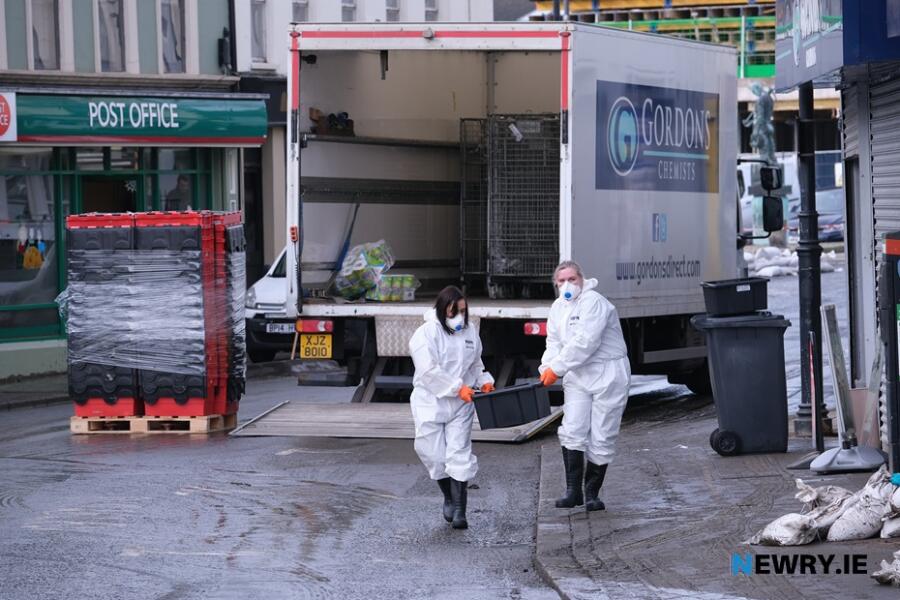 Gordons Chemist Staff clear out their flood damaged store in Sugar Island, Newry in November 2023. Photograph: Columba O'Hare/ Newry.ie 