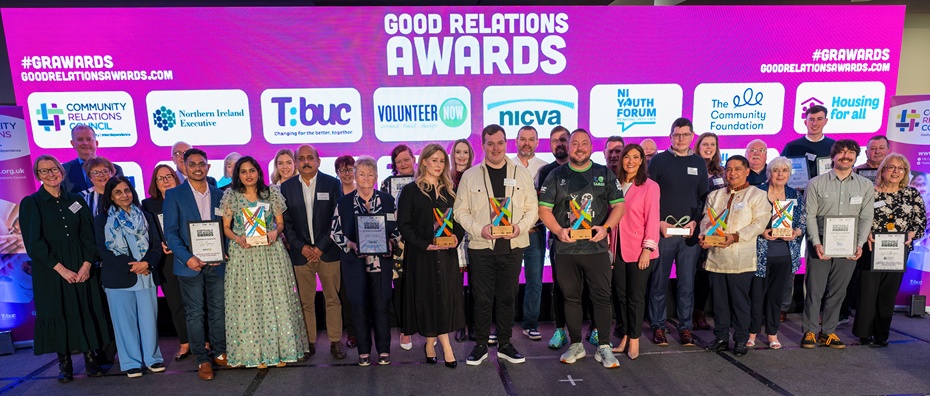 Community Champions recognised at the Good Relations Awards 2026, with winners Jesus Castaneda (Kabalikat / BIMAAK NI), Jordan Doran (Westland Community Group), Dr Marianne Doherty (Ulster University Prison Project), representatives from Newry Mela 2025 (Newry Indian Arts Club), representatives from TAMHI and Valerie Walker (Old Mill Court, Sion Mills) pictured alongside fellow finalists and highly commended recipients.